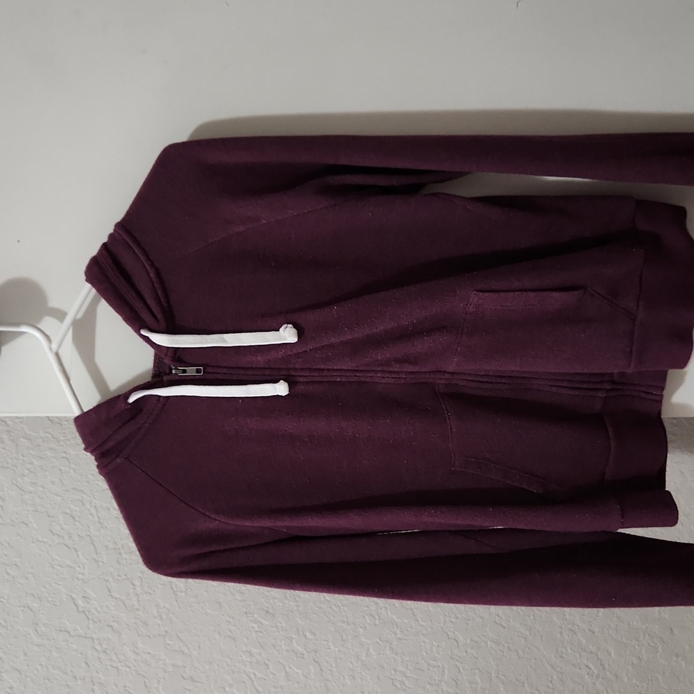 Jacket with drawstring hood and thumb holes